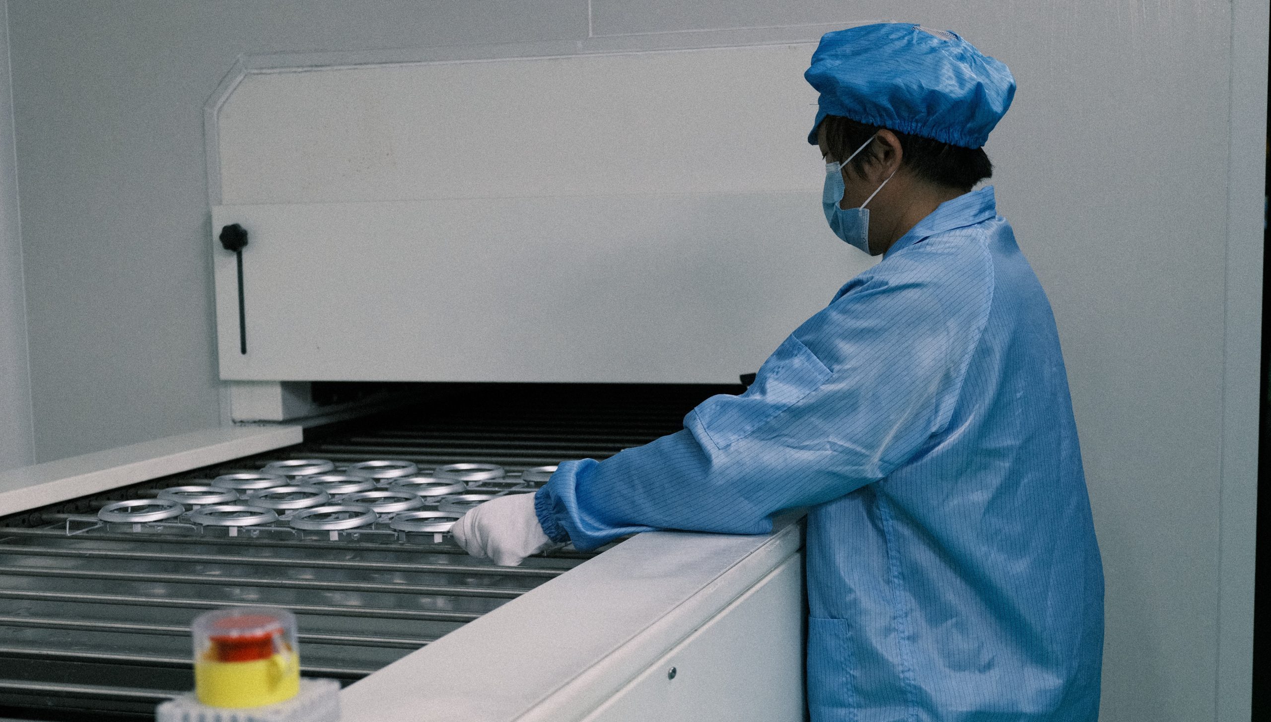 Painted parts moving through the controlled curing stage.