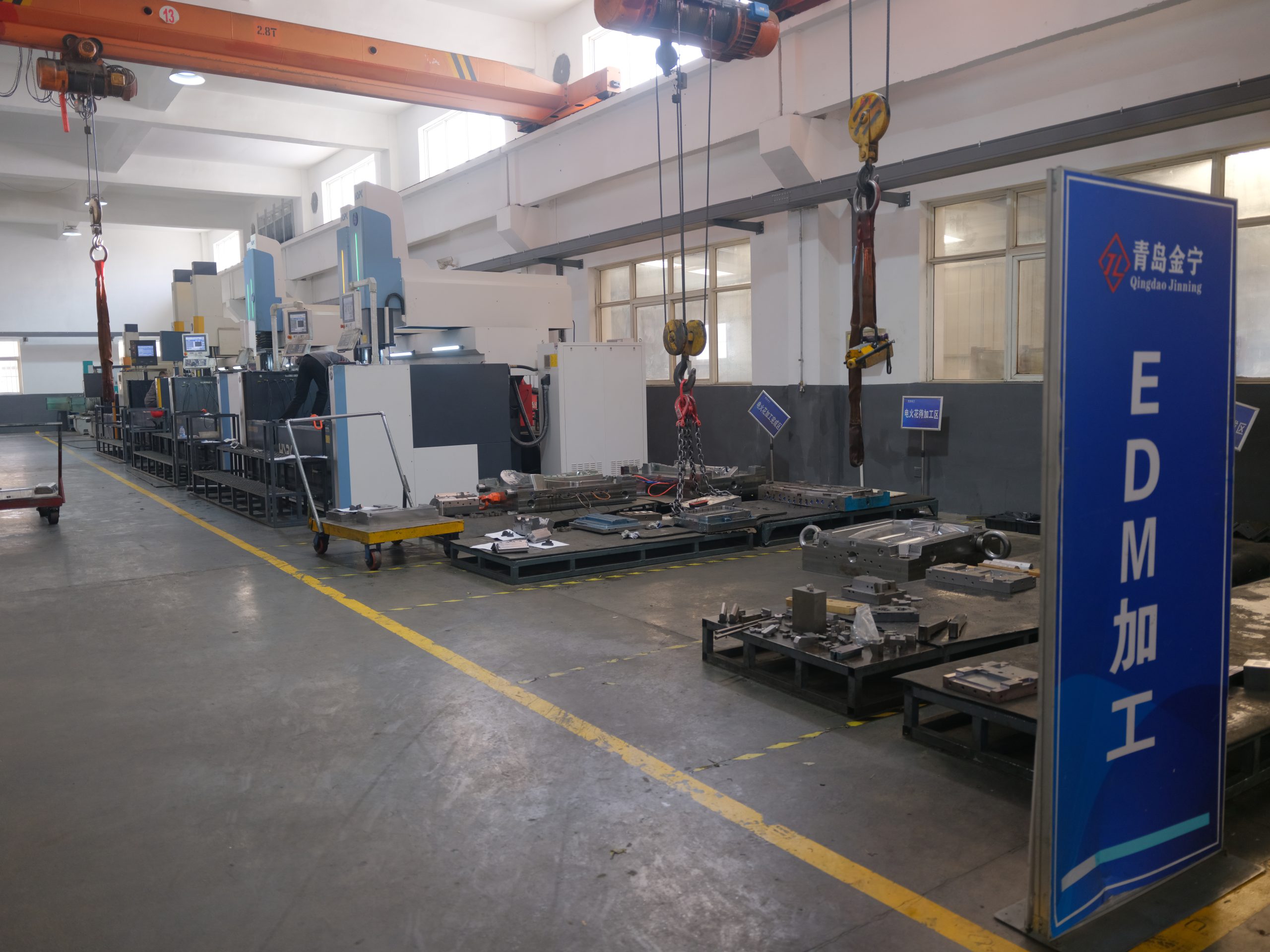 EDM machining area inside Qingdao Jinning factory.